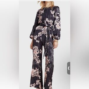 AnthropologieHarlyn Audria Black & Multicolor Floral Long Sleeve
Jumpsuit
